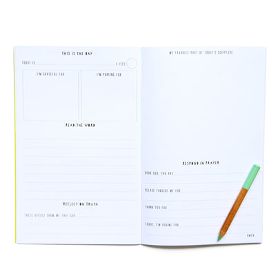The James Method Dwell Bible Study notebook for kids laying open with a pencil on top. Different sections in the bible study notebook include being grateful, place for bible verse, drawing area, response.